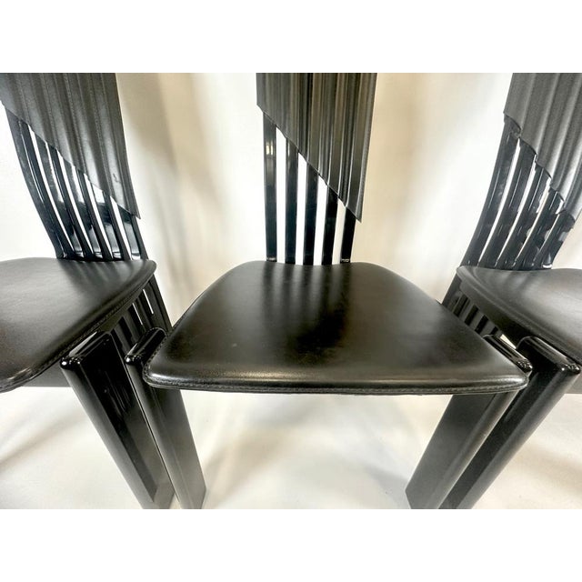 Italian Modern Tripod Chairs from Lübke, 1980s, Set of 4, in Very Good conditions. Designed 1980 to 1989 This piece has an...