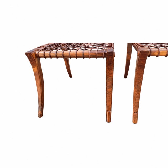 Pair of Solid Walnut Klismos-Style Ottomans in the Manner of T.H. Robsjohn-Gibbings Graceful and sculptural, this pair of...