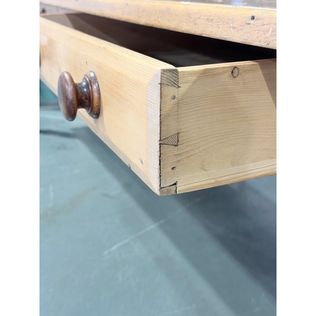 Khaki Early 20th Century Antique English Pine Farmhouse Dining Table With Two Drawers For Sale - Image 8 of 9