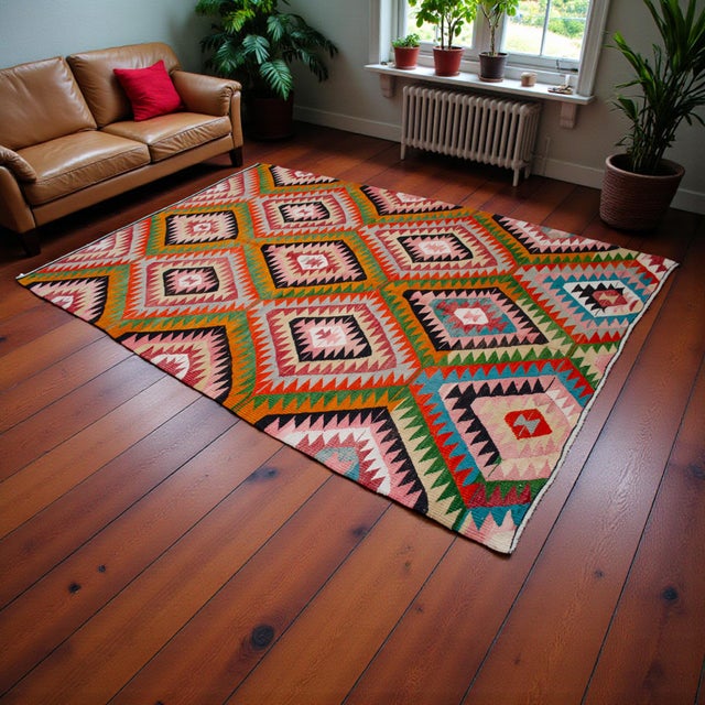 Handwoven in southern Turkey by Yoruk villagers of Antalya, this 1970s kilim captures the joyful rhythm and geometric...
