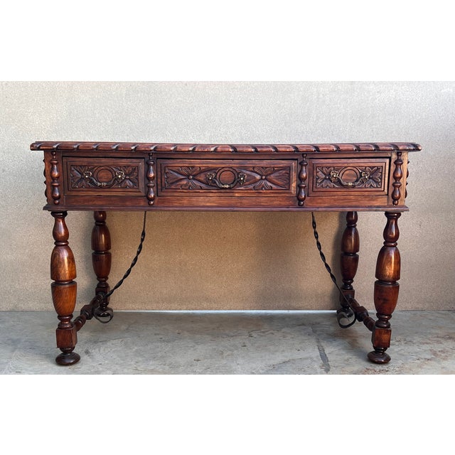 This elegant fruitwood desk was created in France, circa 1920. Made of blond walnut timber, the large writing table sits...