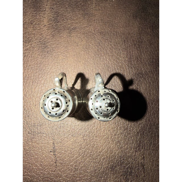 Salt and pepper shakers from the late 19th century produced by Bailey Banks and Biddle in the style of Tappan hen...