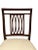 Consisting of eight side chairs, each with a rectangular back with trellis splats, upholstered seats raised on square...