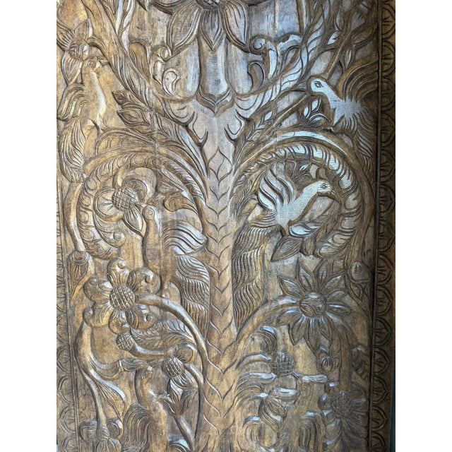 Bring soulful artistry and timeless character into your space with this vintage Tree of Life carved sliding barn door,...