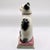 A charming 19th-century antique English Staffordshire pottery mantel figurine depicting a seated black and white cat....