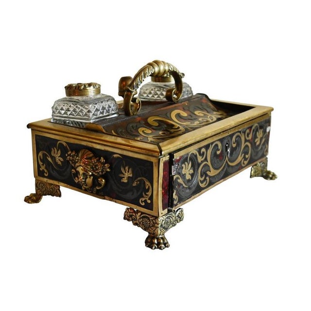 Fine French desk inkwell decorated with ornate brass Boulle-style marquetry over a rich red tortoiseshell-effect ground...