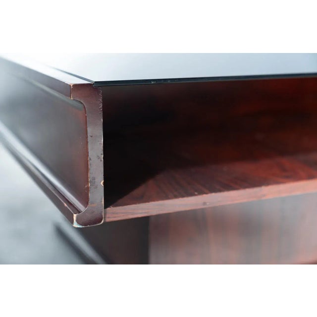 Vintage Mahogany Coffee Table with Glass Top – 1970s This elegant vintage coffee table, crafted in the 1970s, showcases...