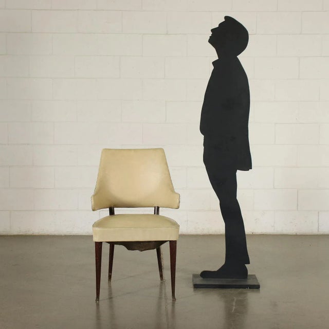 Elegant chair, spring padding, ski coating, tinted beech wood legs. This piece is attributed to the mentioned...