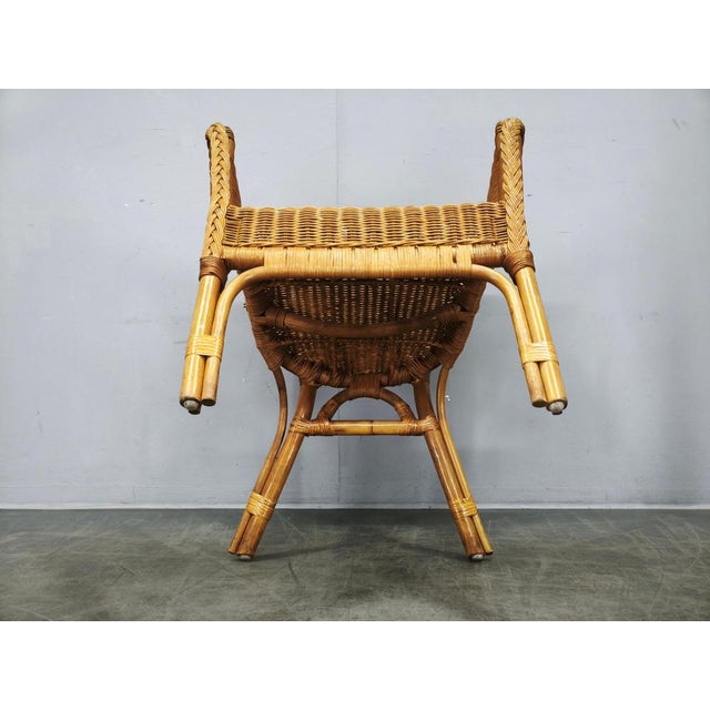 A charming and highly decorative Italian rattan and wicker lounge set from the 1950s, comprising four matching armchairs...