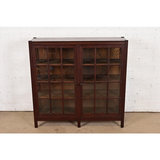 A beautiful antique Mission or Arts & Crafts period glass front bookcase or display cabinet In the manner of Stickley...