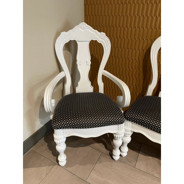 These are a lovely set of carved French Provincial dining chairs including two arm chairs. Set of 6 chairs total. The wood...