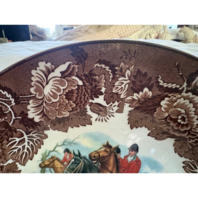 This Wood and Sons plate features men hunting on horseback in a classic English fox hunt. The horses of various colors are...