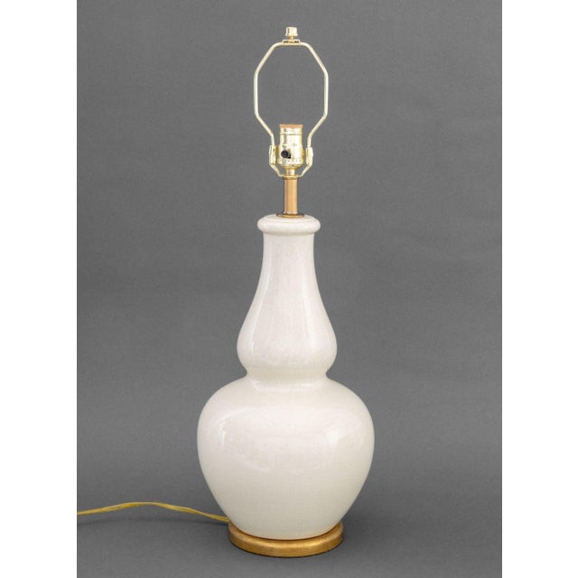 Christopher Spitzmiller Style Double Gourd Table Lamp, white crackle glazed porcelain above gilt base, Festoni label to...