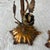 Pair of vintage Italian candlesticks with rose design. Gold gilded and has patina.