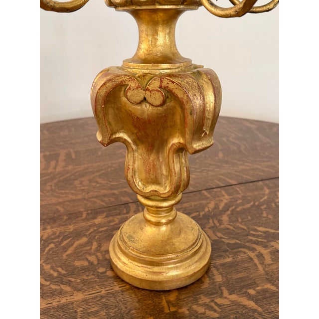 This Italian Rococo gold gilt candelabra with 5 arms glows beautifully when lit with candles. Please see condition details...