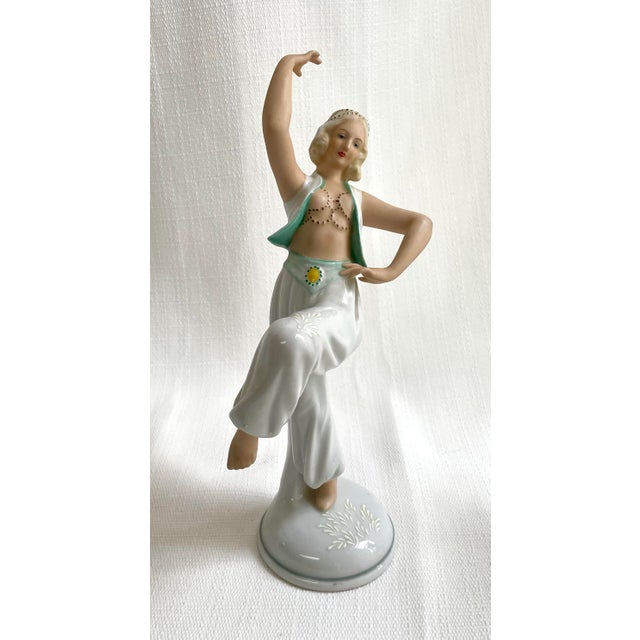 This beautiful adorned belly dancer is caught mid dance. Made in Germany by Schaubach Kunst who are known for their high...