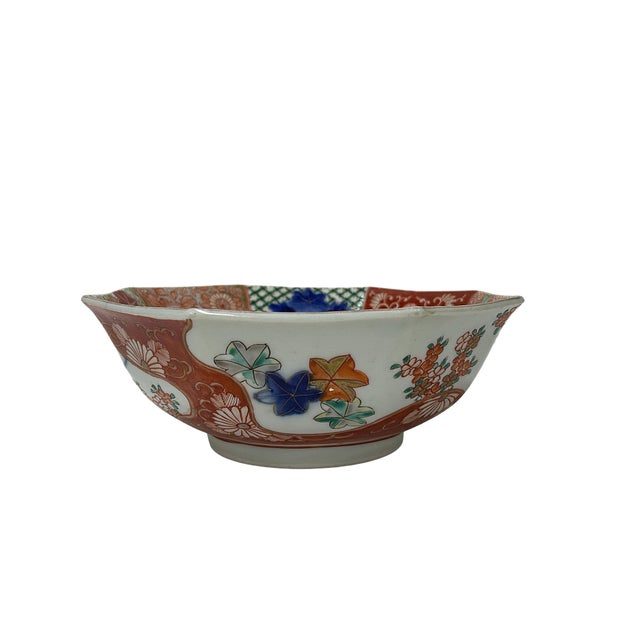 This exquisite, heavily potted oriental porcelain bowl features a distinctive multi-lobed octagonal form with flaring...