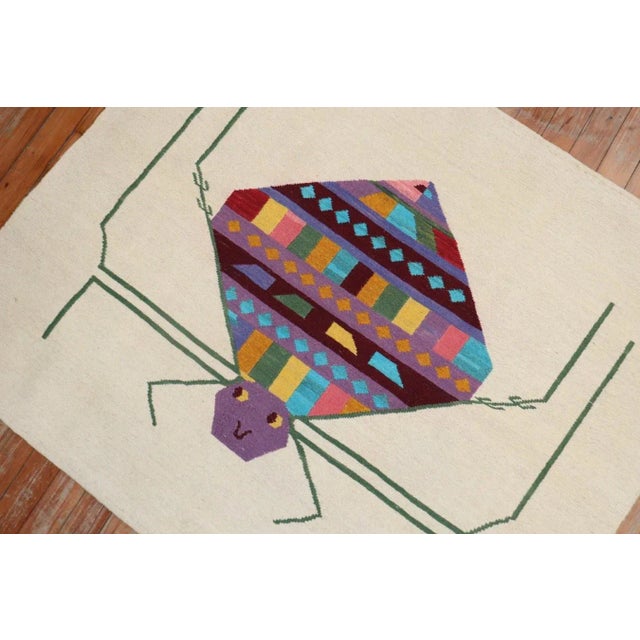 Scatter size Persian Kilim from the late 20th century with a happy go lucky colorful Spider on a beige field 3'2'' x 3'9''