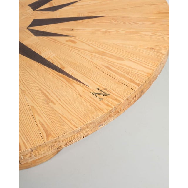 Rosa dei Venti round table in pinewood designed by Mario Ceroli for Poltronova in the 1970s. This table is part of the...