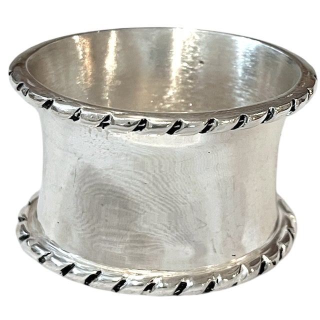 A handsome set of six vintage napkin rings with a beautifully simple, substantial form. Each features a wide polished...