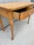This piece is an antique bird eye maple writing table or vanity desk likely dating back to the late Victorian or Queen...