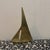 This vintage item is a Mid-Century Modern solid brass sailboat, a popular decorative piece from the 1960s and 70s often...