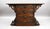 A highly decorative carved oak partners writing table, fitted with a green tooled leather writing surface and richly...