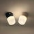 Pair of Italian opaline glass wall lights produced circa 1970 and preserved in remarkable new old stock condition. These...