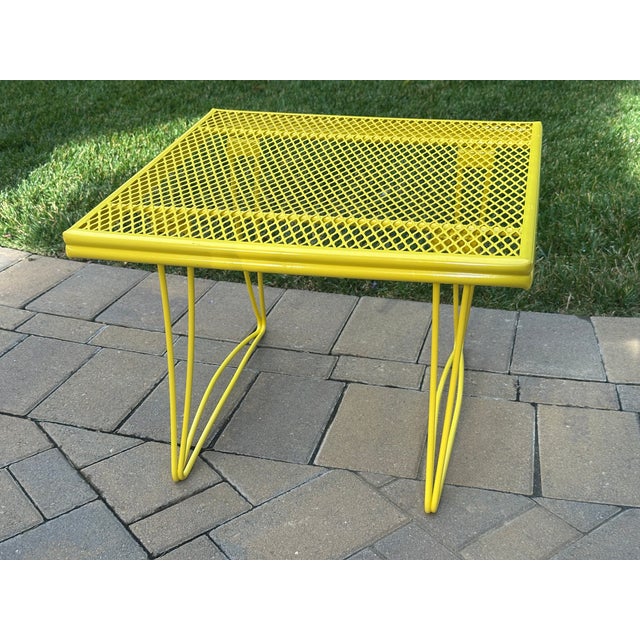 This stylish Homecrest patio side table stands on curvy, double-wire legs and has a steel, diamond-grid top. Its welded...