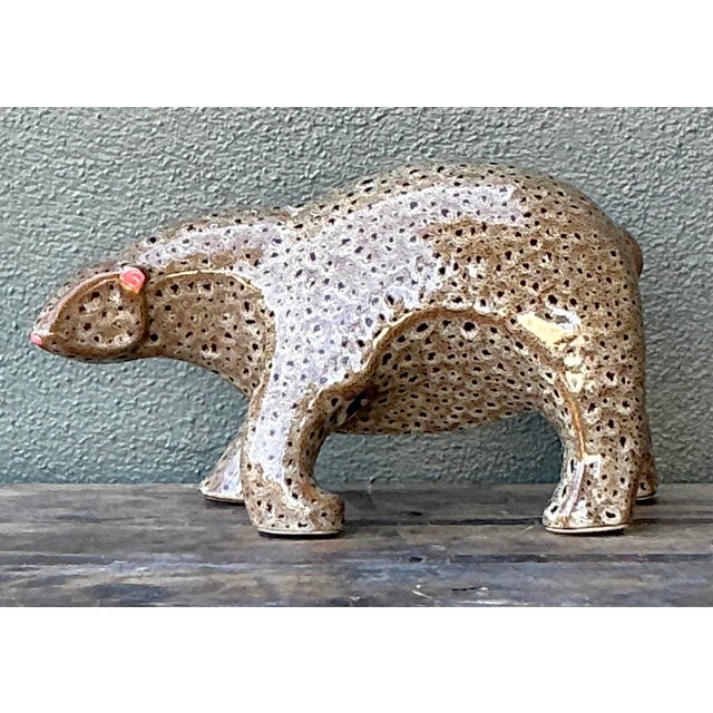 Introduce a captivating element of wildlife charm to your interior with this substantial vintage ceramic polar bear...