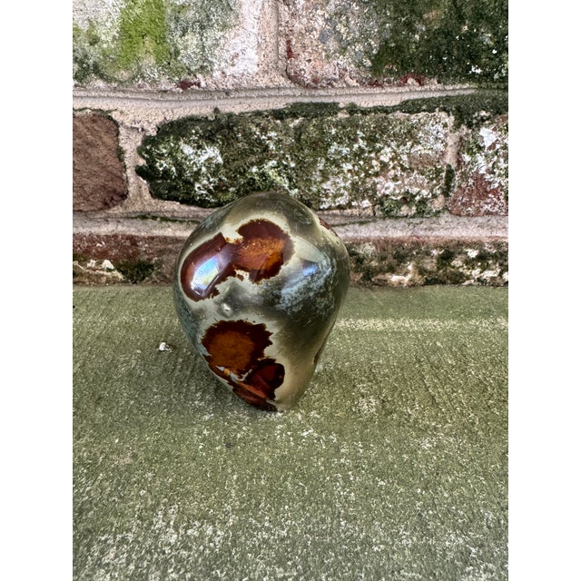 Vintage polished stone paperweight. Beautiful variation to the stone, with areas of burnt orange and maroon on a green...