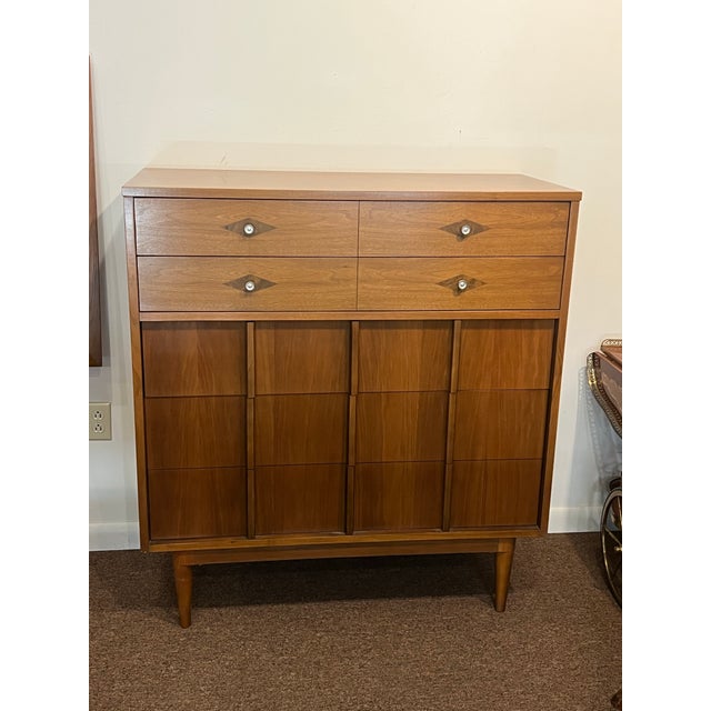1960's Mid-Century Modern tallboy/highboy by Basic Witz. This line features 5 dovetailed drawers, tapered legs, paneled...