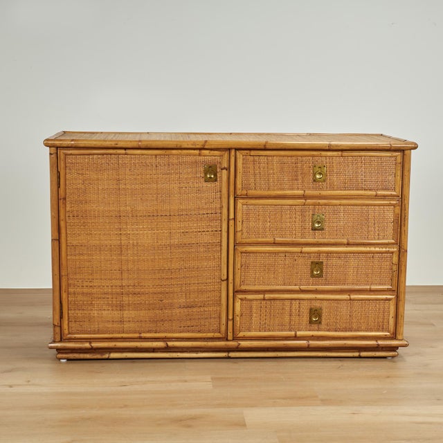 Casual yet elegant vintage French dresser crafted in bamboo and grasscloth in modern form with four drawers and a cabinet...