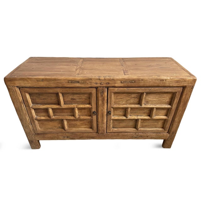 Antique Mongolian thick sturdy elm wood sideboard. Carved brick patterning on two doors and on sides. Original natural...