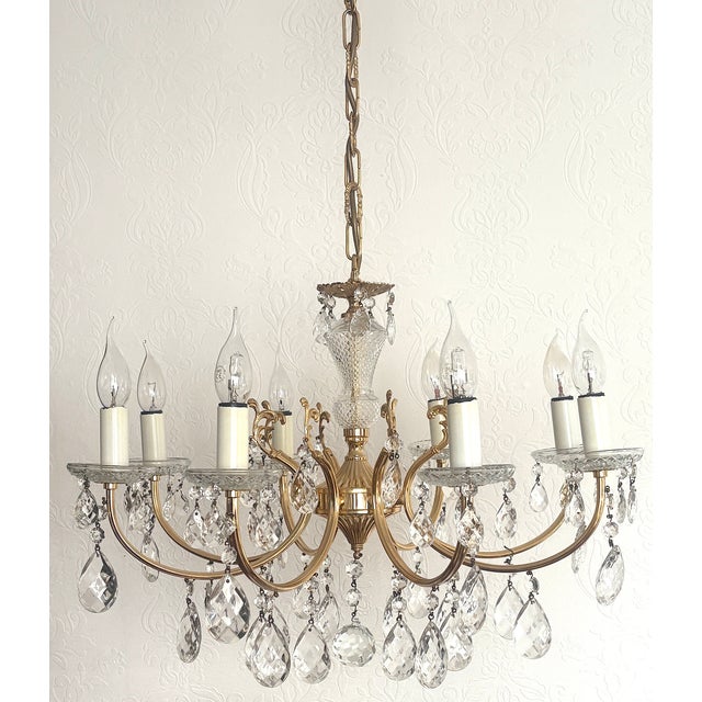 Brass and Lead Crystal 8-Light Chandelier, 1960s, in Very Good conditions. Designed 1960 to 1969 I have official proof of...