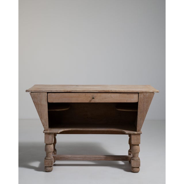 A striking Brutalist bar piece emphasizing strong geometry and raw material presence, characteristic of 1960s–70s design....