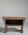A striking Brutalist bar piece emphasizing strong geometry and raw material presence, characteristic of 1960s–70s design....