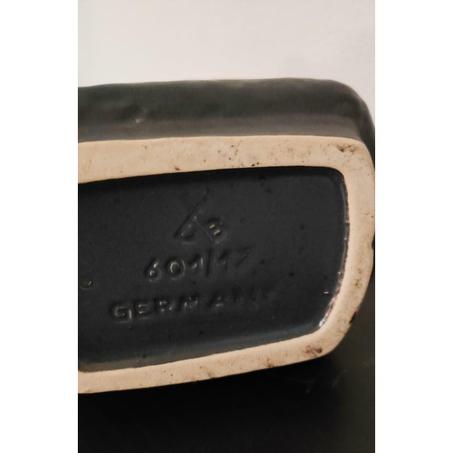 A classic 60s design. Vase with handle by Fat Lava in the classic "Sundown" decoration from the 1960s, with a rough black...