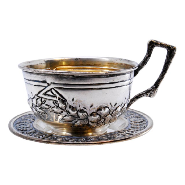 Silver Cup and Saucer with Embossed Floral Motifs and Appliquéd Handle, Set of 2 For Sale