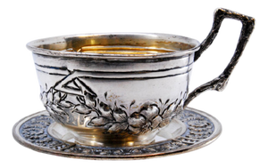 Silver Cup and Saucer with Embossed Floral Motifs and Appliquéd Handle, Set of 2