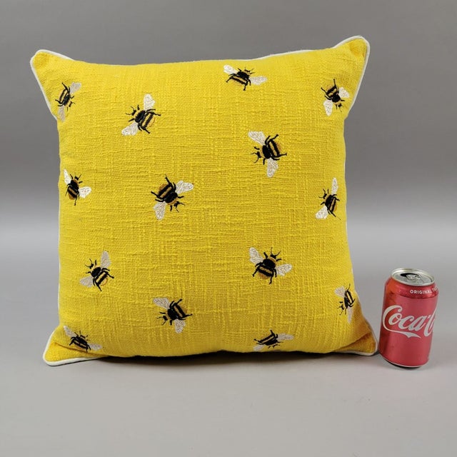 Cheerful, 21st Century bright yellow throw pillow with embroidered bees. Very clean, it is a cotton blend, and fiber...