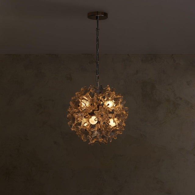 A blooming sputnik from 1960s Italy, attributed to Paolo Venini for VeArt. Murano glass flowers extend from a central...