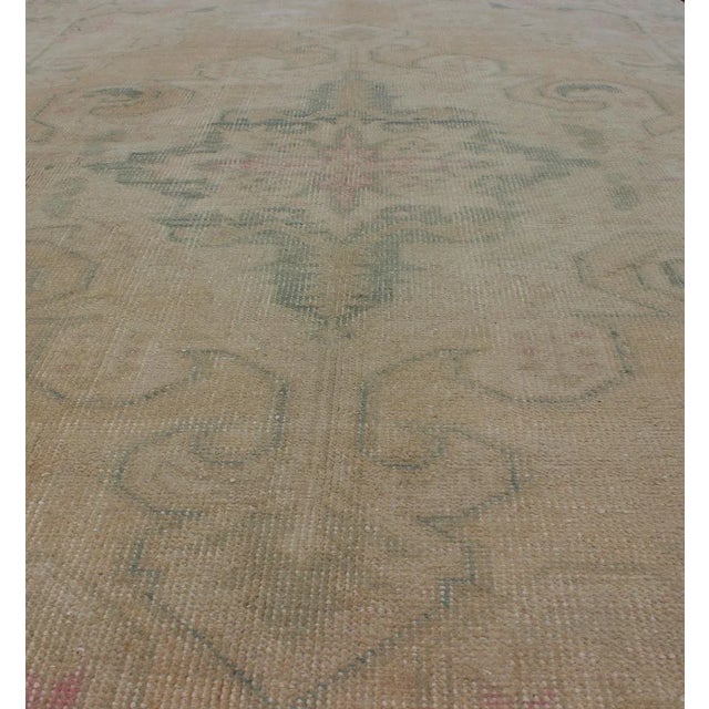 Textile Vintage Oushak Rug From Turkey With Muted Colors and Floral Medallion For Sale - Image 7 of 11