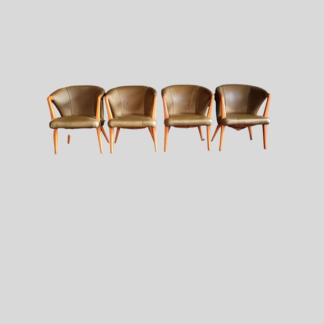 This exceptional set of four vintage club armchairs dates from the 1950s and originates from the former private clubhouse...