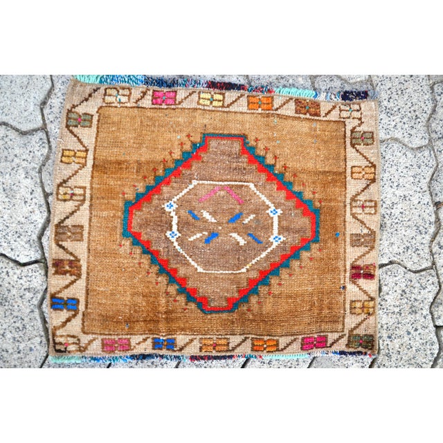 This is a vintage Turkish Oushak rug from the 1960s. The piece was hand-knotted.