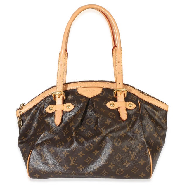 Item #: 154255 Interior Material: Fabric Size: GM Features Interior: Three slip pockets Dimensions: 13 x 10.5 x 7 in...