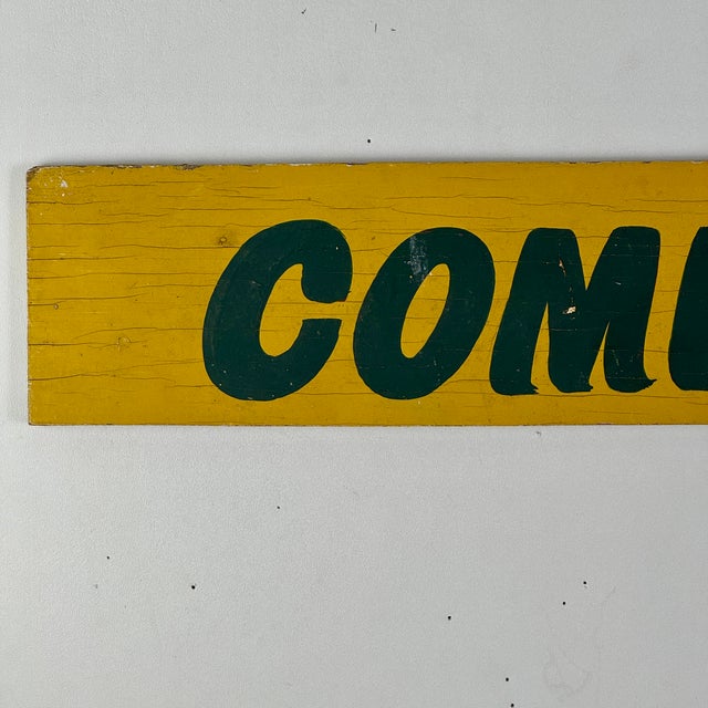A pop of gorgeous yellow on this straight forward sign that says "commercial". It's hand written in a dark green. What we...