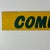 A pop of gorgeous yellow on this straight forward sign that says "commercial". It's hand written in a dark green. What we...