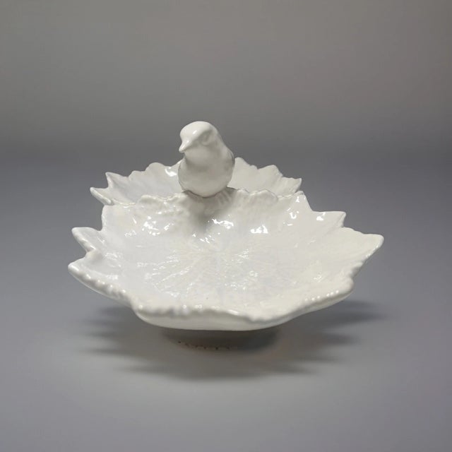Bring timeless Portuguese craftsmanship to your table with this beautiful **Bordallo Pinheiro White Double Leaf with Bird...