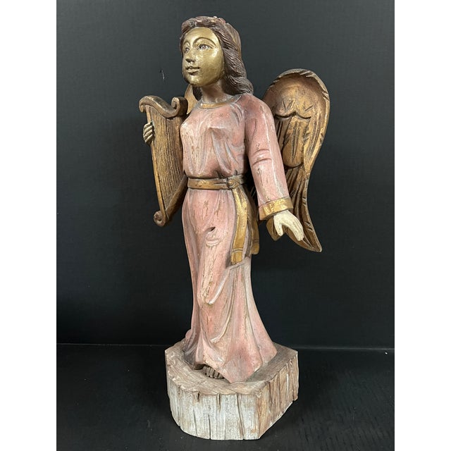 ITEM NAME: Vintage Hand Carved Wood Standing Angel Playing Lyre Instrument Sculpture ORIGIN: Philippines AGES: Late 20th...